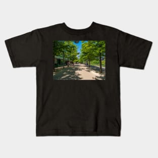 Blue skies,trees and shades at the Olympic park Kids T-Shirt